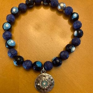 Hand painted stretchy beaded evil eye bracelet.